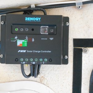 Media 'The original Renogy kit included this controller, which worked fine, but I moved it to the travel trailer and upgraded to a better system for the boat.' in album 'I used this idea for several years and realized 200 watts was overkill for me.  I remounted one 100 watt panel on standoffs on the middle of the roof.  This clears the hand rails and looks neater.'