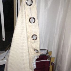 Media 'Starboard view: detaching the clip from the handle is swift allowing for easy access without disturbing the set-up.  This has made our lives so much easier.' in album '01 Marinaut 215 cockpit temporary portable toilet enclosure.  This enclosure is very private, and because the sides are flexible can easily expand out to about 3 feet wide.  (In this picture, the enclosure falsely appears to be only 18 inches wide because the wind, blowing into the cockpit from the right is pushing the curtain in toward the stern.)'