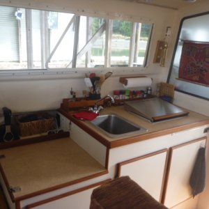 Starboard side, the helm seat easily  removes for extra galley counter space.
