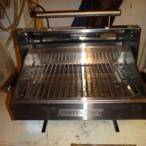 Media 'It will never be this clean again. I broke down and ordered a rod holder type mount for this puppy. As the economy gets worse we hope to live off road kill. (sic)' in album 'New Spitfire grill. Will show on boat with Florida pics'