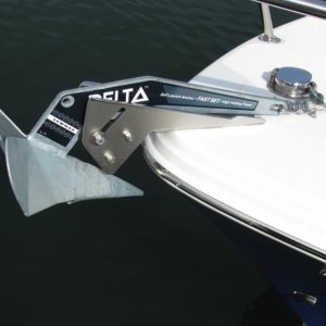 Close up of 14# Delta anchor. It has 25' 1/4" HT chain and 200' of 1/2" Anchor line.  On June 14-15, we used this arrangement for the first time.  It sets easily by hand, and it releases easy by hand.  It held fast in the 10-foot muddy river bottom, with winds around 5 knots, and large power cruisers passing by.  This confirms that did not need a windlass for new England, where the waters are shallow (as opposed to the PNW, where a windlass is desireable.) REVISION:  We no longer use the 14 pound anchor, because it does not hold in silt.  We now use a 22 pound Lewmar Delta, which I think would benefit greatly from a windlass.