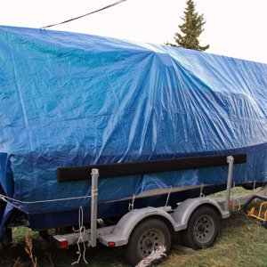 Starboard view of blue tarp.  Cost: < $100, used 4 years and counting.  Good deal for me!  And it works good too!