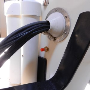 Fuel port next to outboard cable exit with rubber dust cap