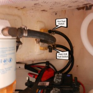 Media 'I split the output of the Racor into a Y-fitting and put two valves on the outputs, one for the main engine, and one for the auxiliary port.' in album 'Fuel port next to outboard cable exit with rubber dust cap'
