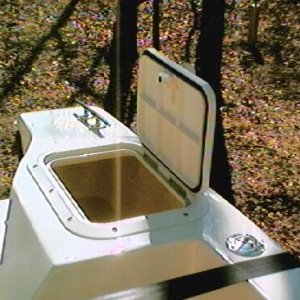 Hatch plumbed to the bilge.  It will become an insulated cooler as soon as I figure out how to properly insulate it.