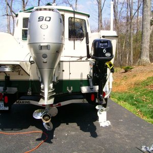 I plan to attach a rod from the main to the kicker. This way I can steer from the helm.  I have pretty good access to the kicker from the cockpit.