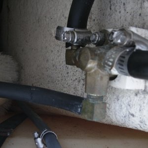 I tried to send the fuel line down the fuel fill - no go; too sharp a bend.  I then disconnected the fuel line to the tank selection valve and could pump gas from one tank and then the other, from one tank to the other.