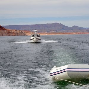 Towing the dinghy behind Hallelujah, with Marie at the helm of Thisaway.