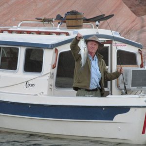Yes! Tex catches a nice size fish. Notice ice cream maker on top of cabin.