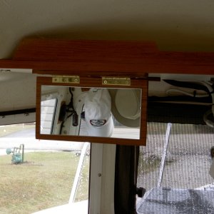 Media 'Valkyrie: Fold-down vanity mirror is glued to teak. Brass hinges and screws are used.  In response to a few PM's: the mirror wasn't centered on the aisle because that space is reserved for future projects.  The mirror is only sightly above the other seat, but can easily be used when standing in the aisle.' in album 'Valkyrie: Fold-down vanity mirror is glued to teak. Brass hinges and screws are used.  In response to a few PM's: the mirror wasn't centered on the aisle because that space is reserved for future projects.  The mirror is only sightly above the other seat, but can easily be used when standing in the aisle.'
