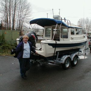 (Joy) Sandra with the Boat when we pulled it out from Lake Washington 1st time out
