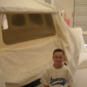 (Joy) What it is all about Joshua, grandson at old factory seeing boat being built