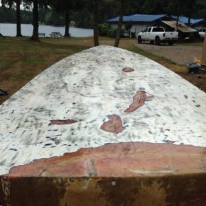 bottom paint removed.  gouges ground out and ready for repair.  Whole bottom to be sanded smooth.