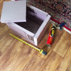 Media 'This will be the insulated container for the TEC.  I'm gluing it together with foam.  It is 1.5" foam board that comes in a 2x8' piece.  If I think I need more insulation, I will simply make another exterior layer from the left over piece.  It is small, but then so is my boat.' in album 'This is a thermo-electric chip (TEC) with an air cooled copper heat sink salvaged from a computer on top and a length of 1.5" copper pipe filled with antifreeze on the bottom.  It is stuck together with thermal epoxy.'