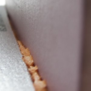 Media 'The foam cures to a stage that is similar to a roasted marshmallow when cooling.  At a certain point it is still in a plastic state, but not sticky on the exterior.  Any areas that were over filled can be pushed into a fillet using a finger.' in album 'This is a thermo-electric chip (TEC) with an air cooled copper heat sink salvaged from a computer on top and a length of 1.5" copper pipe filled with antifreeze on the bottom.  It is stuck together with thermal epoxy.'