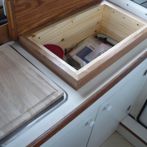 Media 'Top lifts up and there is a nice storage area under the cutting board' in album 'We wanted more counter space and storage so we removed the alcohol stove and use the portable butane cooker. These are great little stoves and boil water in 2 min.'