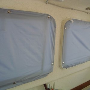 Window covers. SuperMicroft, a light-weight water-repellent polyester.  Lined with cotton-poly.  Snapped to window frames.