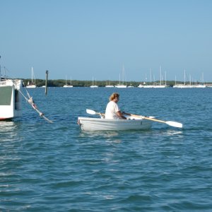 Judy rowing back from puppy patrol and showers...