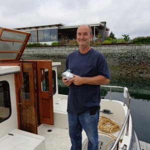 Media 'Bill holds a loaf of zucchini bread for him and the crew. Don't need a mutiny on the way home.' in album 'Bill, Robert & Ken at the Anacortes Airport Friday morning.'