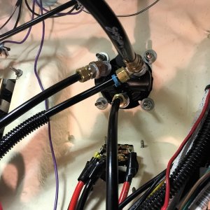 Back of the helm plumbing. Bottom line is return hose to Smart pump.  Single vinyl hose goes to Shadow drive, and past that is tee\'d off to Smart pump and main steering hose.  Tee is main steering hose and vinyl hose to Smart pump.