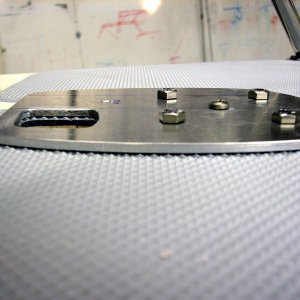 (AnchortownJim) Quick ASTER 500 mounting plate made out of 3/16" 6061 aluminum, prior to being epoxied to the deck with MarineTex, side view.