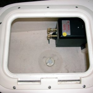 (AnchortownJim) Trim Master pump, mounted in the port lazerette.