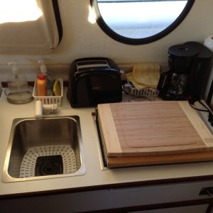 We have added a 750 Watt Sunbeam toaster (Model TSSBTR2SBK) and a 650 Watt, 5-cup Black and Decker drip coffee maker (Model DCM600B), that fits neatly on the countertop, does not inhibit use of the Wallas, and has vastly made more pleasant our overnight stays.  We still love the Wallas for cooking our meals and providing heat, but it really is more convenient to use the electric appliances in marinas. Notice, too, that we added a cutting board to fit on top of the Wallas.  It does not slip because we used one of those rubber shelf liners underneath.  It does not get jostled around while underway -- we can attest that it stays in place in 4 foot following seas!  Notice, too, the plug strip, which has a 15 amp breaker that we use with a portable shore power set-up as recommended on this site by others more knowledgeable than me.