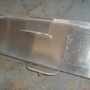 This picture, sent to me by Les Lampman, shows the bottom step attached to the fuel tank and sitting on the shop floor prior to its installation in the boat.  After installation, the top step is attached and the gray covering material is affixed to the sides of the tank to make it look sleek.  It was great to see the under-step, vertical support strip that was in this design.  The step holds my 250 lbs. weight without unduly flexing.  It's quite robust.
