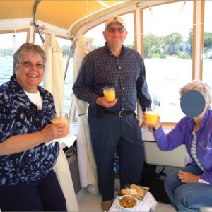 Media 'The Marinaut 215 cockpit has plenty of space for entertaining guests.  We had 4 people in the cockpit enjoying Mimosa's and cheese while anchored (with anchor dragging) on the Niantic River in Niantic, CT.  To give one an example of scale, I'm 6 feet 250 lbs.' in album 'The cabin, shown with the bulkhead removed in Les' photo on Facebook, in our view is quite large.  One could argue that it is really 7' 7" long, and the 5' 9" berth extends out 18" into the cabin, which allows a person to sit on the berth while visiting with three other people in the cabin, as well as allowing easy access to the portable toilet under the center cushion.  Of course, when the left, rear cushions are put into place, the berth extends to a total length of 7', reducing the floor space in the cabin at night.  Visually however, the cabin still looks 7' 7"' long.  That's the genius of this design.  Please notice, too, the width of the floor in front of the dinette and galley:  it is wide enough for two people to easily pass one another, which we feel is an important feature for living comfortably in a small boat.'