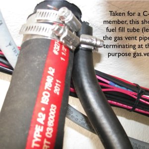 Close up of fuel fill and vent pipes terminating at the the combination fuel fill/vent pipe.