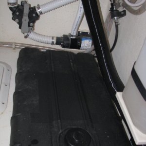 6 gallon fuel tank, 3-1/2 inches high, 30 inches" long, fuel pump is on wall to the right