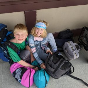 Ryan and Lillian packing gear