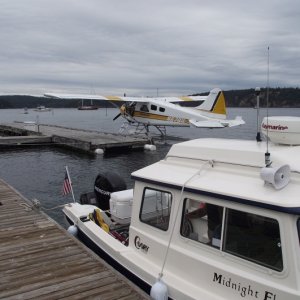 Media 'Midnight Flyer tied up near a float plane.' in album 'Buffalo River State Park, Minnesota. Storms over night left a mess of tree stuff on my car and boat...'