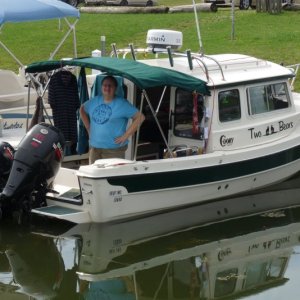 Finally in the water.  The Canal had a leak and they closed just east of Lockport.  So we found "Mid Lakes Marina near Masdon, NY. It held 2 C-Dorys in it's 30 boat home goup and the owners group was having a pot luck that night and had us join them.  Penny was really glad to get Two Bears in the water.  "It ROCKS" she said.