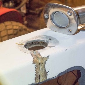 Now it starts to get ugly. This is what happens when you have no backing for bolts holding rod holders and you don't seal holes that go through cored areas. Core is mushy here. Rod holder on other side didn't crack cockpit deck, but I'm sure there is core damage there as well.