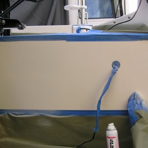Spraying done.  Trust me; the holes are there.  You just can't see them now!