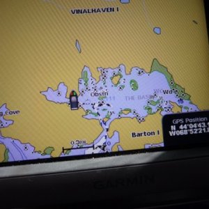 my GPS showing our route in to the basin it looks as though we should have went straight on the way in which is the way we exited more of a straight shot. The following from The Maine Guide book: "The Basin is a magnificent tidal lake cut in the west side of Vinalhaven Island. Here you will find a scattering of little islands, depths as great as 111 feet, and good swimming. The only problem is a narrow, crooked, and obstructed entrance through which the current usually rushes like a millrace. Entering the basin is not recommended except for the most daring of gunkholers. Rarely does a year go by without a grounding here. But others have done it. According to local lore, schooners used to winter over inside The Basin. The best time to enter or leave is within an hour of high slack tide. As if the current weren't bad enough, a rock sits directly in the middle of the entrance. The channel runs south of this rock and immediately branches at a small island. Once safely through the channel, you can enter The Basin either to the left or right of the small island, but the right branch is wider. Another rock lies to the southeast of the island. Head southeast past the island, keeping the rock to port, then turn slightly to port, rounding the rock and heading east into The Basin. Anchoring options are plentiful. So are the rocks. Be careful."