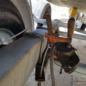 Disk brake trouble fix. The locater studs somehow backed out leaving the caliper unmoored. I checked the rest and found another stud half backed out. I tied it to the frame with some 1/8 ss welding wire, with 3 brakes I am glad I have a 1 ton truck, heavy with really strong brakes!!