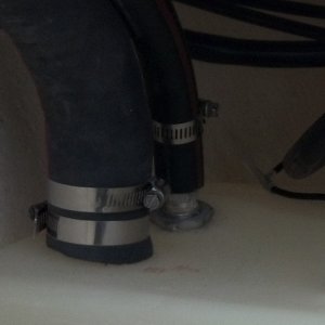 Routing the cable and tightening the fuel tank vent hose.