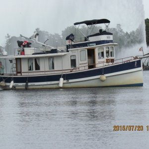 IMG 5216 This boat was from Louisiana about 40 foot. The picture is in Peterborough the aerator in the back round is lit up with colored lights at night. Nice place to stop. They have an ice cream there called Tiger it's marbled with orange and black licorice flavored ice cream. Good Stuff