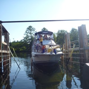 P1020422 Another 40' boat coming into the carriage to ride overland with us. Low speed maneuvering was not the captains  strong suite. They were a retired fireman from Staten Island New York doing the loop.