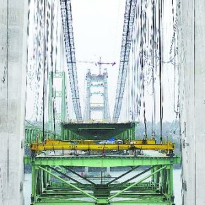 Media 'This picture is from the local paper and shows one of two sections that will slip between the two towers. The towers inside width is 1 1/4 inches wider than the bridge deck!' in album 'Tacoma Narrows Bridge Construction'