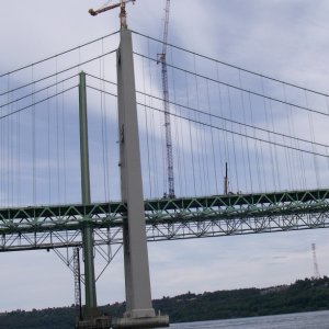 Media 'The last major job was to remove the two cranes from the top of the towers. This was done with a huge mobil crane that took the tower cranes down in 8 separate pieces.' in album 'Tacoma Narrows Bridge Construction'