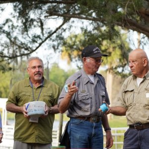 Nancy and John, ticket sellers, Bill (Mystery Girl in his volunteer ranger suit and Tom  explains the 50/50 raffle