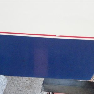 11 transom screws or former screws sealed with adhesive sealant were removed, properly filled, and a gelcoat patch kit applied.  Color matching of the kit was definitely off.