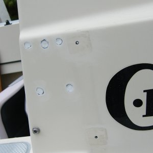 Holes were drilled out, cleaned, and surfboard epoxy filled.  Gelcoat will adhere to surfboard epoxy with no problems. Holes are ready for gelcoat.