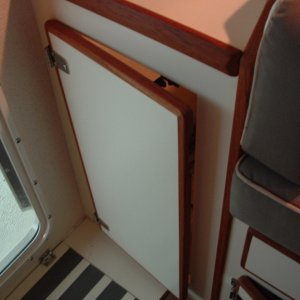 The hanging locker that wasn't tall enough to hang clothes in.