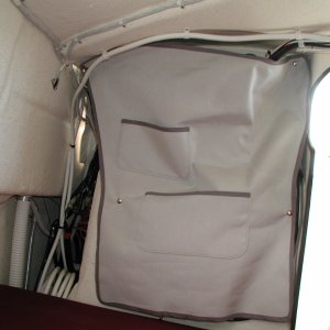 New cover for back of helm.  Pockets sewn in for small articles.