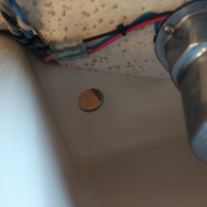 Had a kind of hack job hole at the very back of my console so I decided this would be a great place for a couple of USB ports. Got out the drill and a step bit and made the hole nice.