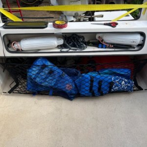 \"Trunk cargo net\" from Amazon. Is shaped like a taco so it adds a little extra storage.
